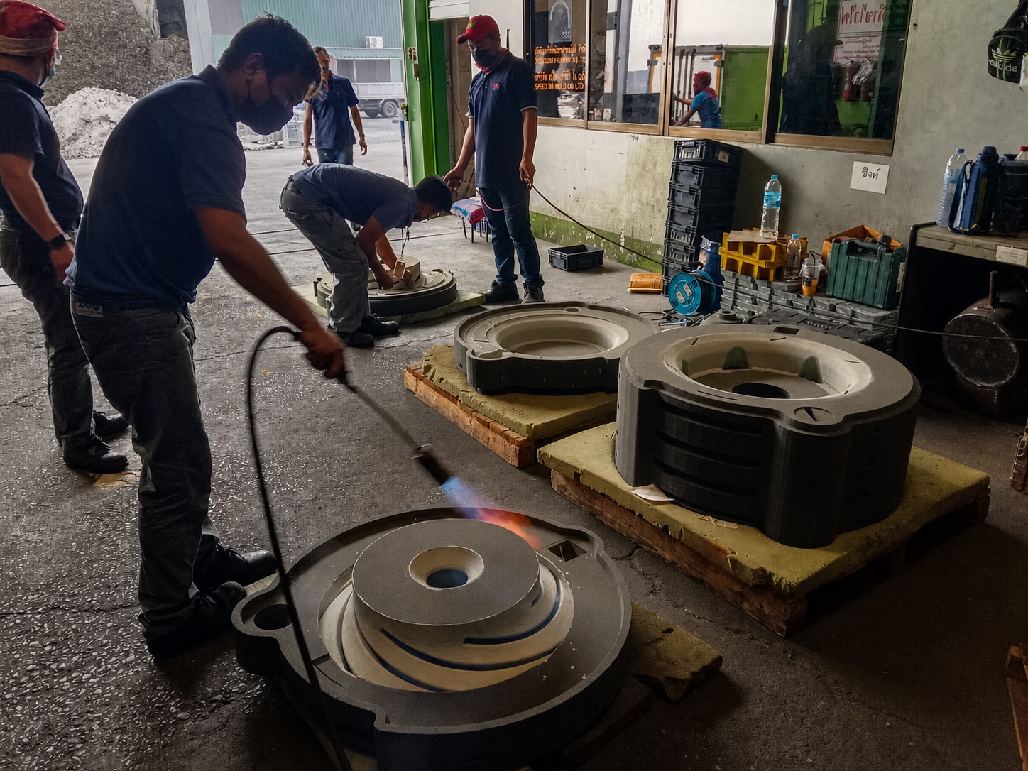 3D-printed sand molds prepared on the foundry floor for closed impeller casting