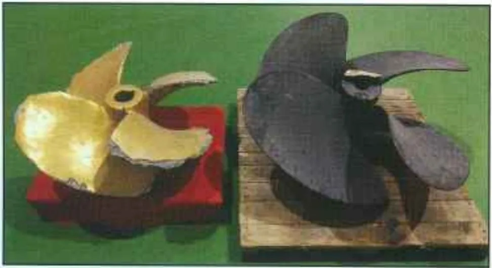 Worn original 1,000 mm propeller alongside the re-designed cast replacement before machining