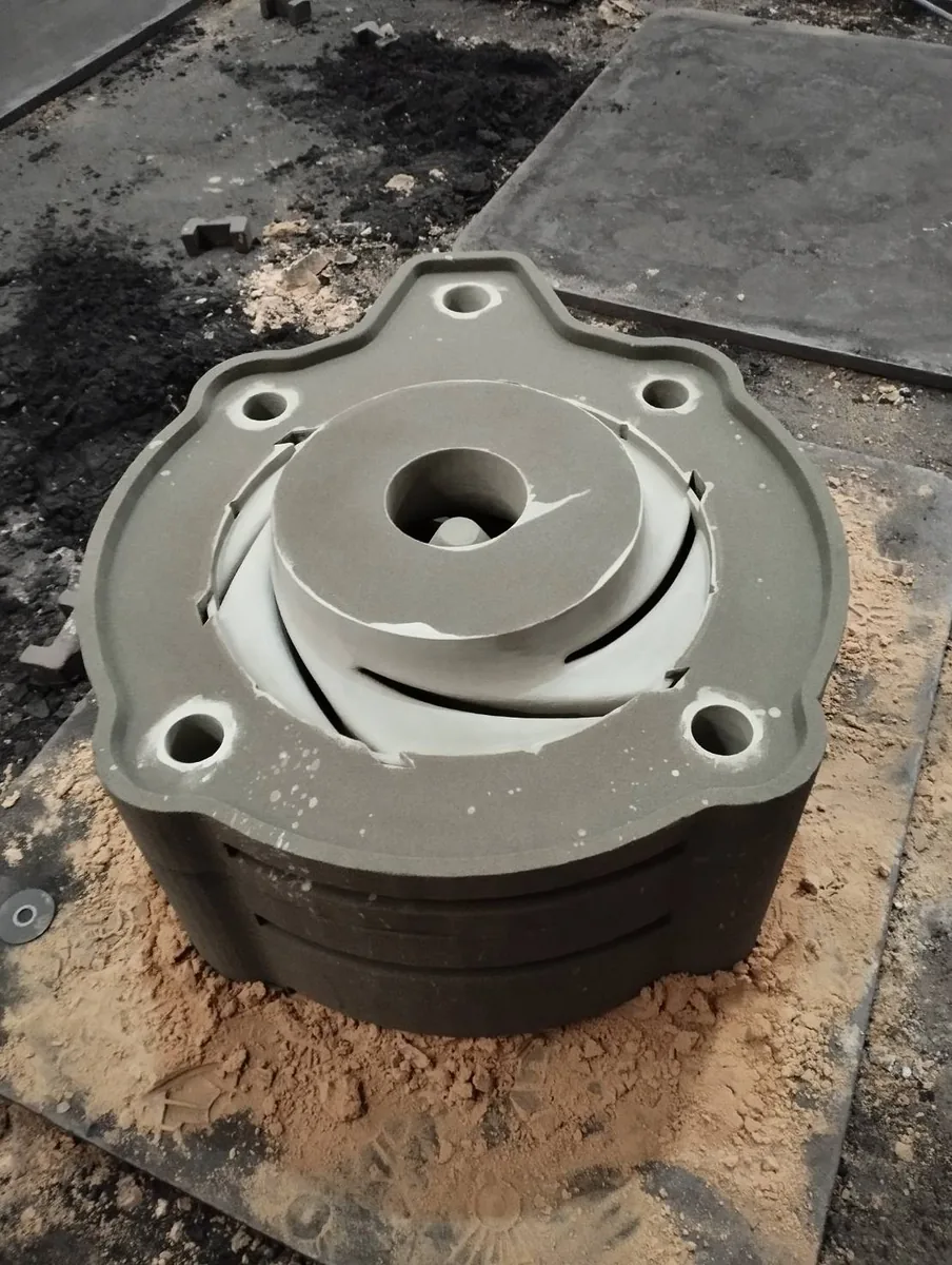 Printed sand mould with the internal core placed to form internal flow passages