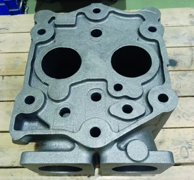 As-cast replacement cylinder head in gray iron, front view
