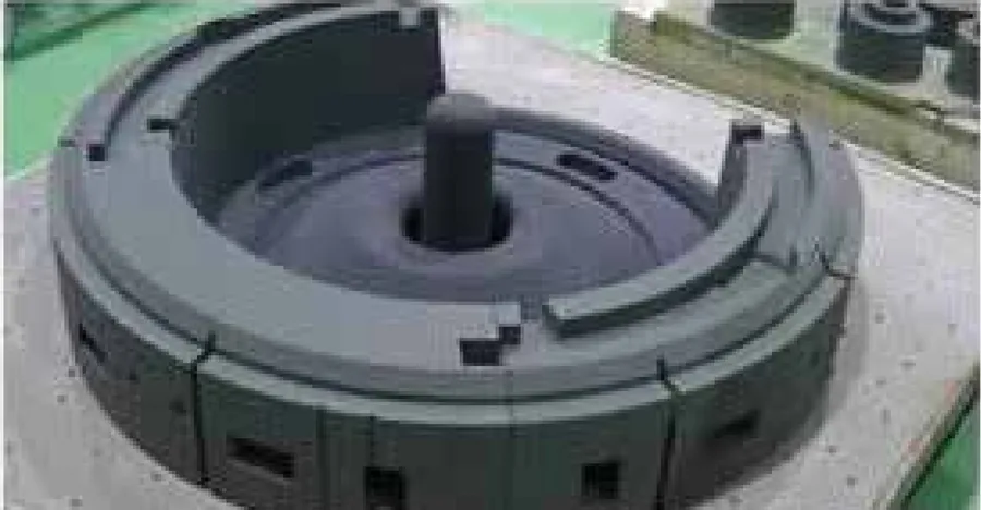 Three-dimensionally printed sand mould section for the cooler shell casting.