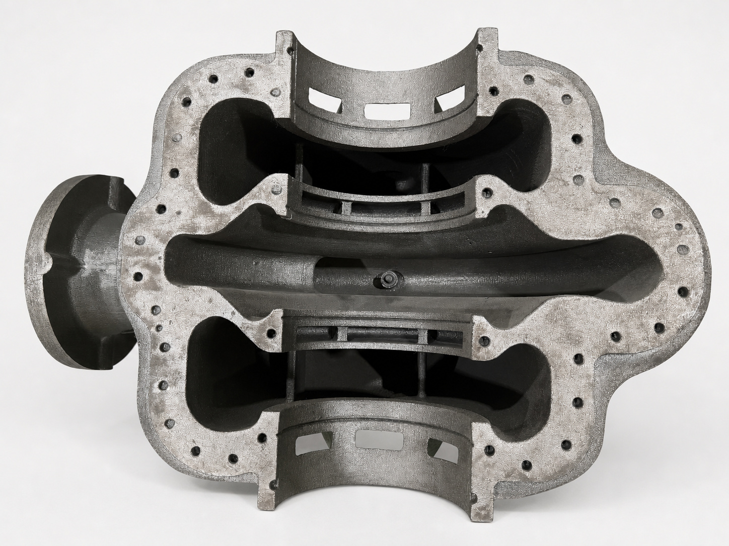 Sectioned cast iron pump casing showing complex internal flow passages