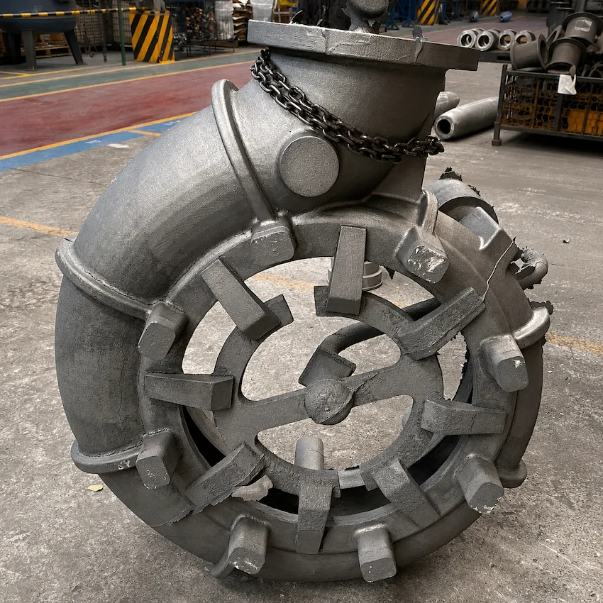 As-cast metal component on the foundry floor with feeders and runner system still attached