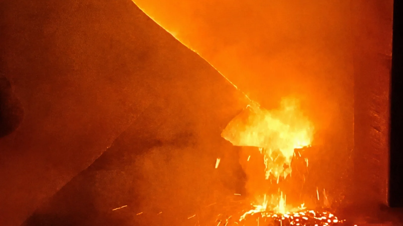 Molten metal being poured during casting production