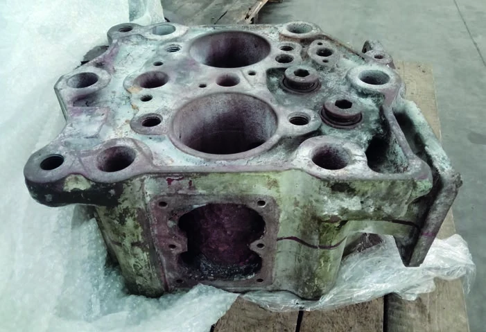 The cracked original marine diesel engine cylinder head that required replacement