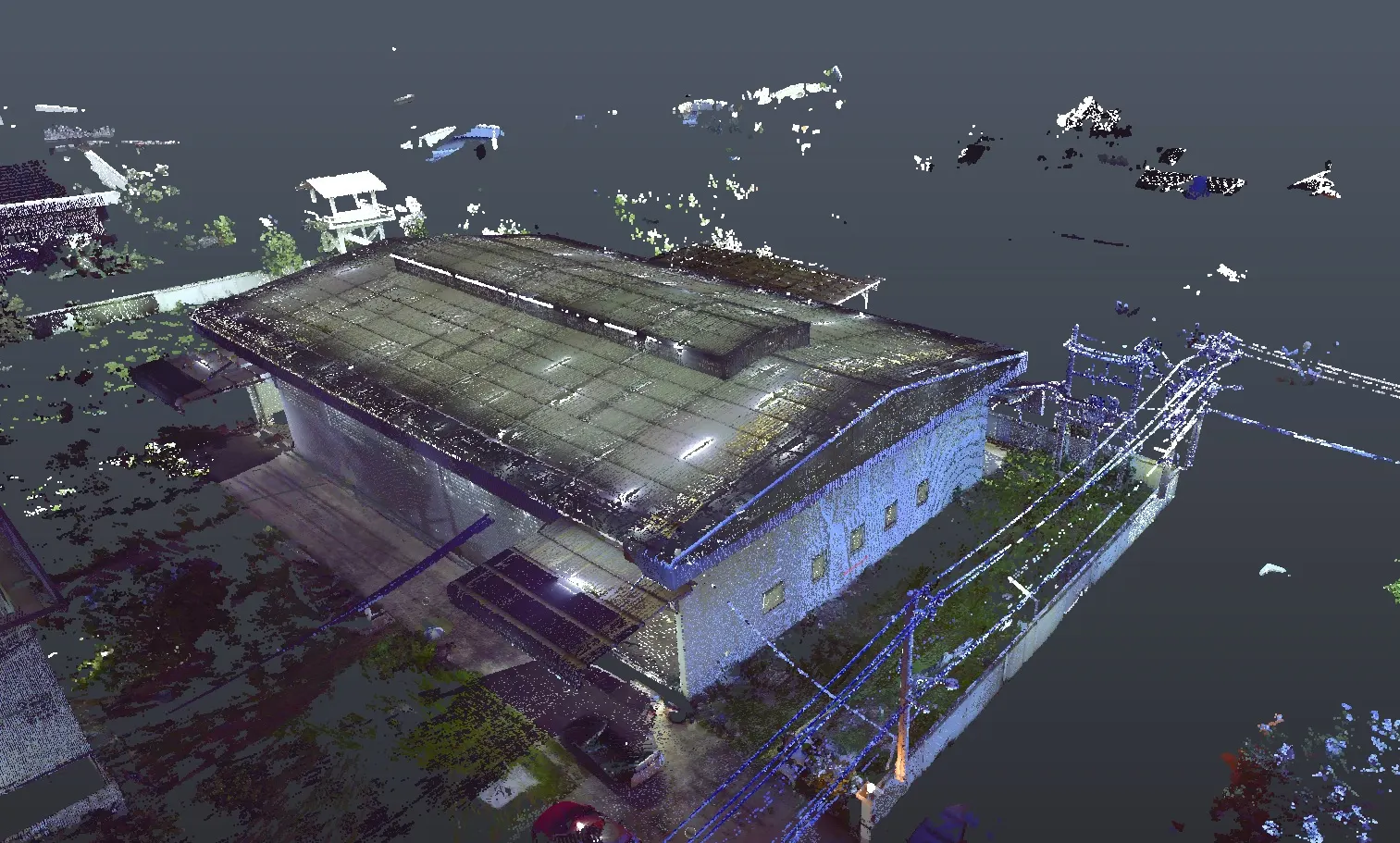 Colour point cloud of an industrial building, roof structure and surrounding site