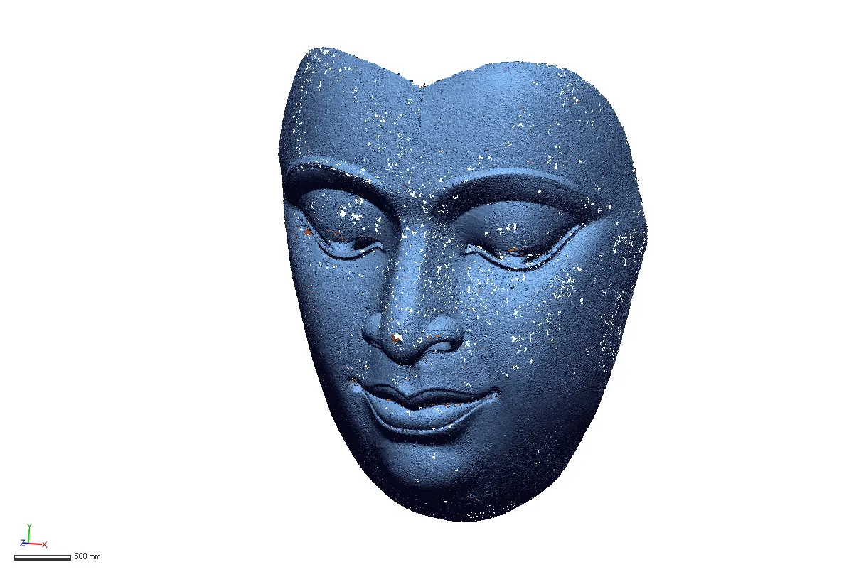 Scanned mesh of a sculptural face showing eyes, nose and lip relief detail with a scale bar